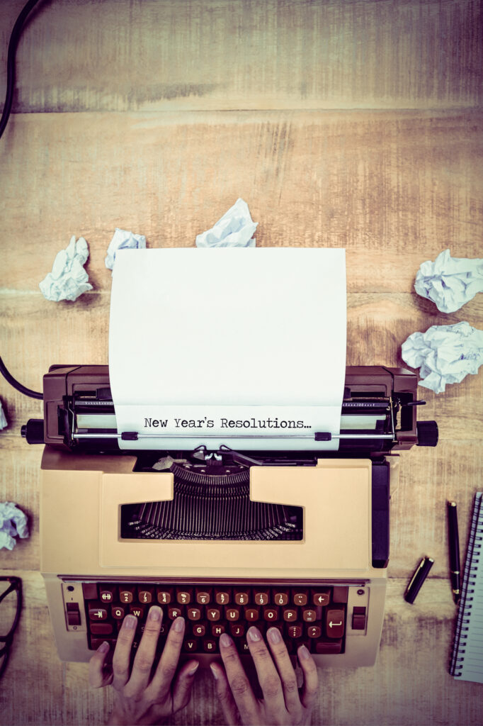 New years resolutions against above view of old typewriter